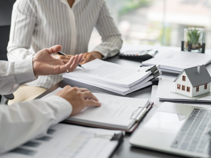 Business people signing contract making deal with real estate agent Concept for consultant home insurance.Real estate investment Property insurance security. Real estate agent
